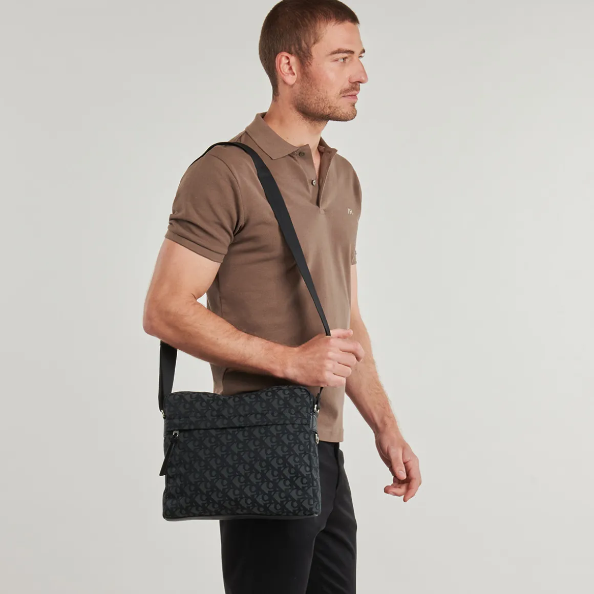 SLOUCHED MONOGRAM ZIP FLIGHT BAG